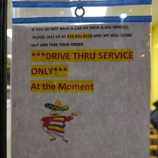 a drive thru service sign