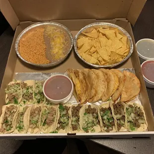 Taco box - Carnitas, Carne, and crispy chicken tacos for the kiddo. Beans, rice, salsa.