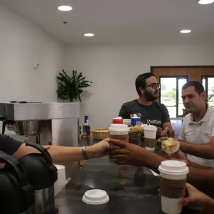 a group of people sitting around a table