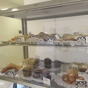 a display case filled with pastries