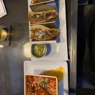 Quesi Birria Tacos with Consommé and noodles.