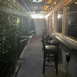 Beautiful discrete and shaded patio with cool side tables