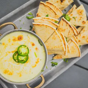 Spinach + Artichoke Dip (V): Fresh Spinach + Artichokes + Jalapeños + Onions + Creamy Cheese Blend + Pico + Warm Pita