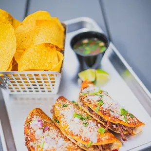 Eduard Birria Tacos: Birria Style Braised Barbacoa + Melted Chihuahua Cheese + Cilantro + Red Onion + Cotija Cheese + Spicy Beef Broth