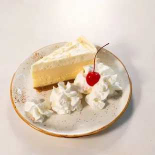 White Chocolate Lemon Cheesecake: Creamy Cheesecake + Fresh Berries + Whipped Cream
