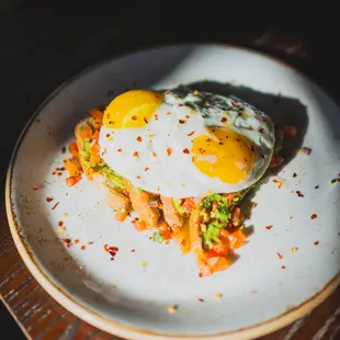 Avacado Toast: Sourdough Toast + Smashed Avocado + Crushed Red Pepper + Sunny Side Up Egg + Pico de Gallo