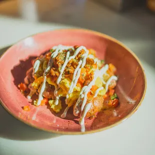 The Inigo Montoya: Scrambled Eggs + Monterey Jack + Diced Bacon + Pico de Gallo + Salsa Verde + Crema + Breakfast Potatoes