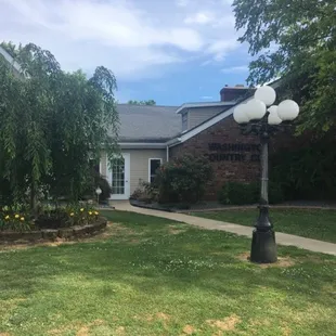 This is the outside of the restaurant. It is located on a golf course.