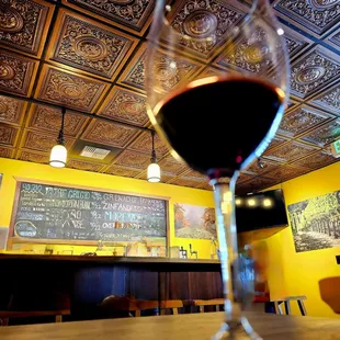 a glass of wine on a table