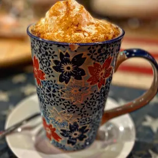 a cup of coffee with a spoon