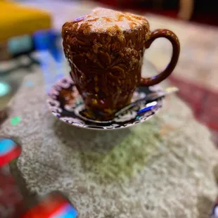a coffee cup on a saucer