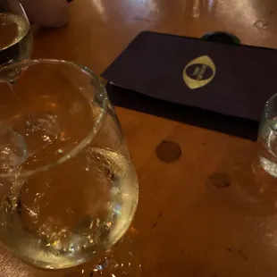 two glasses of water on a wooden table