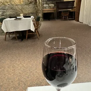 a glass of wine on a table