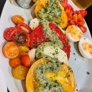 Farm fresh heirloom tomatoes with fresh mozzarella &amp; pesto