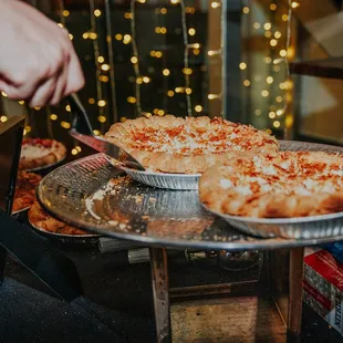 a pizza being served