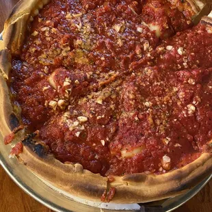 Medium Deep dish pizza with pepperoni, garlic, onion and peppers