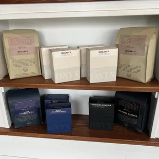 a variety of coffee bags on a shelf