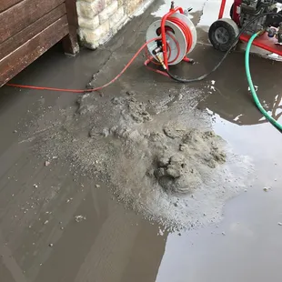 Ok this isn't what it looks like.  Its sand:)  We have high pressure jetting equipment to clear any blockage.