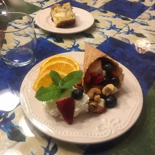 Fruit in a cone with special recipe of whipped cream. Beautiful presentation and very yummy.