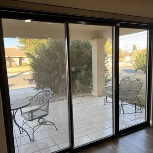 This a sliding patio door can be covered with a shutter or a zebra blind