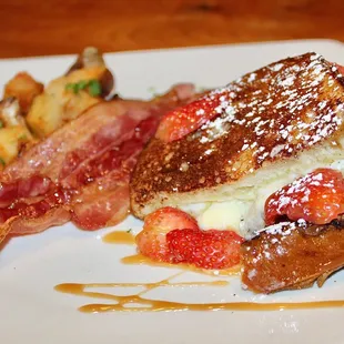 The Sourdough French Toast was made with bourbon banana syrup, mascarpone, and strawberries (Gluten Free option available).