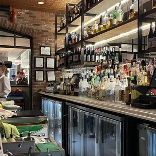 a bar with bottles of alcohol