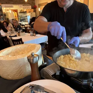 Paola the owner preparing Cacio e Pepe tableside.