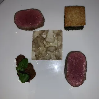 Willamette Valley lamb with potato, green garlic, mustard greens and black olive