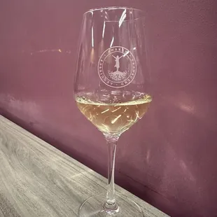 a glass of wine on a table