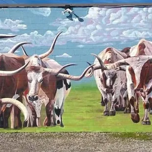 Mural painted on side of building by TALENT