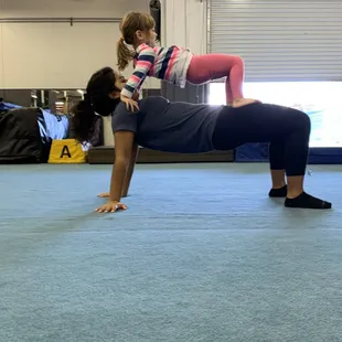 Our youngest practicing some basic Acro skill. Table on table