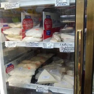 a refrigerated refrigerator filled with cheese