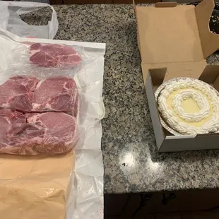 a piece of meat in a box and a piece of cake in a box
