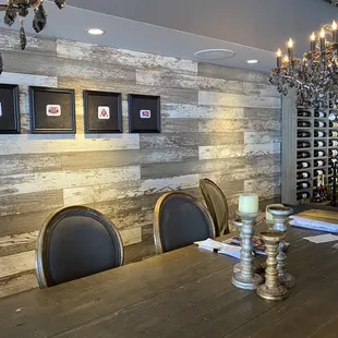 a dining room table with chairs and a chandelier