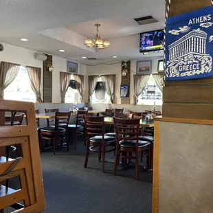 a dining area with tables and chairs