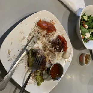 a plate of food and a bowl of salad