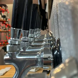 a row of beer taps