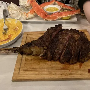 Tomahawk steak (pictured to the right is lobster macaroni)