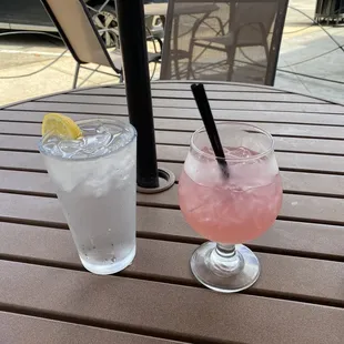 Drink me Alice cocktail. Sour, not sweet. Has edible glitter. Tasted a little soapy.