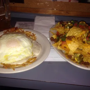 Moco loco: two eggs, gravy, beef patty on crispy hash browns. And nachos.