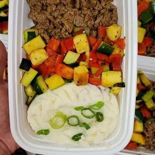 a person holding a container of food