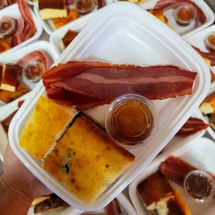 a person holding a tray of food