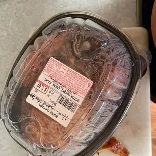 A cooked chicken that I bought with a hair