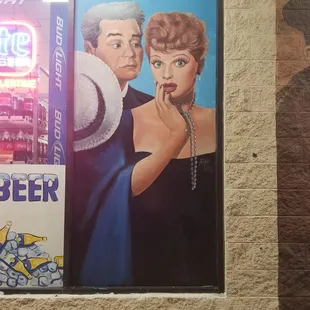a woman and a man in a blue dress