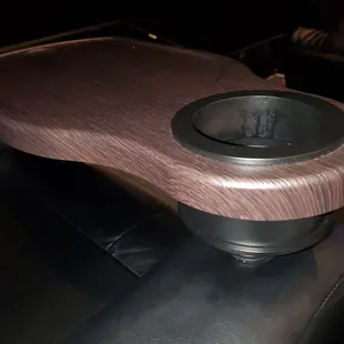 Swivel trays on each recliner seat in the theater.