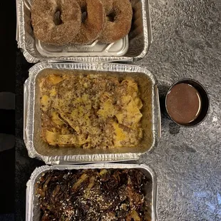 Pickup order of Brussels sprouts, short rib tagliatelle, and cinnamon sugar brioche donuts with cup of chocolate coffee sauce.