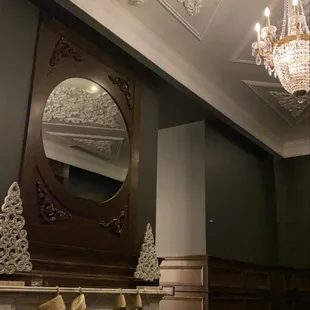 a fireplace with a mirror above it