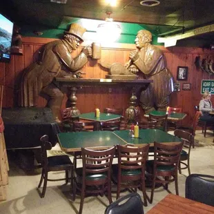 Really unique wooden Harvard statues