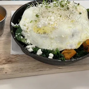 Farmers market skillet with two over easy eggs