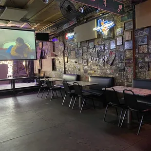 tables, chairs, and a projector screen